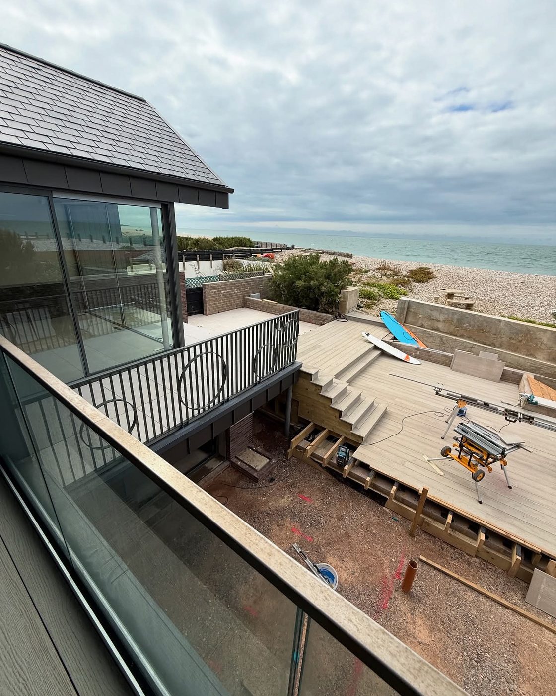 Cleaned decking on a balcony overlooking the beach