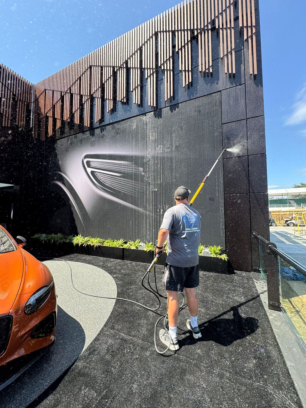 Cladding soft wash in progress at the Bentley Pavilion, Goodwood Festival of Speed
