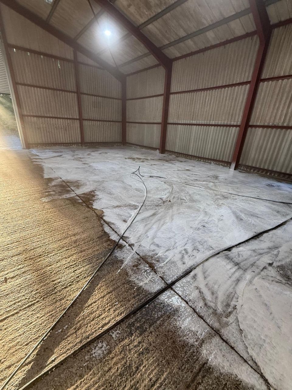 Freshly cleaned commercial car park with crisp white bay markings in West Sussex — large-scale hard-surface and forecourt cleaning