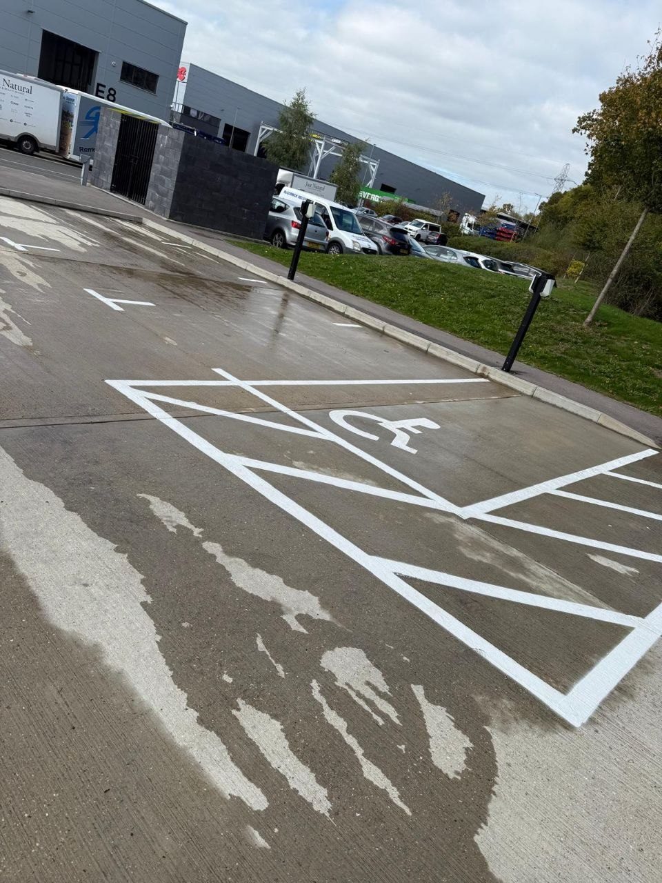 A commercial car park disabled bay cleaned and the markings brightened in West Sussex