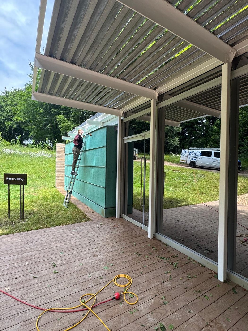 Cleaning a timber event canopy and covered walkway at a venue in West Sussex