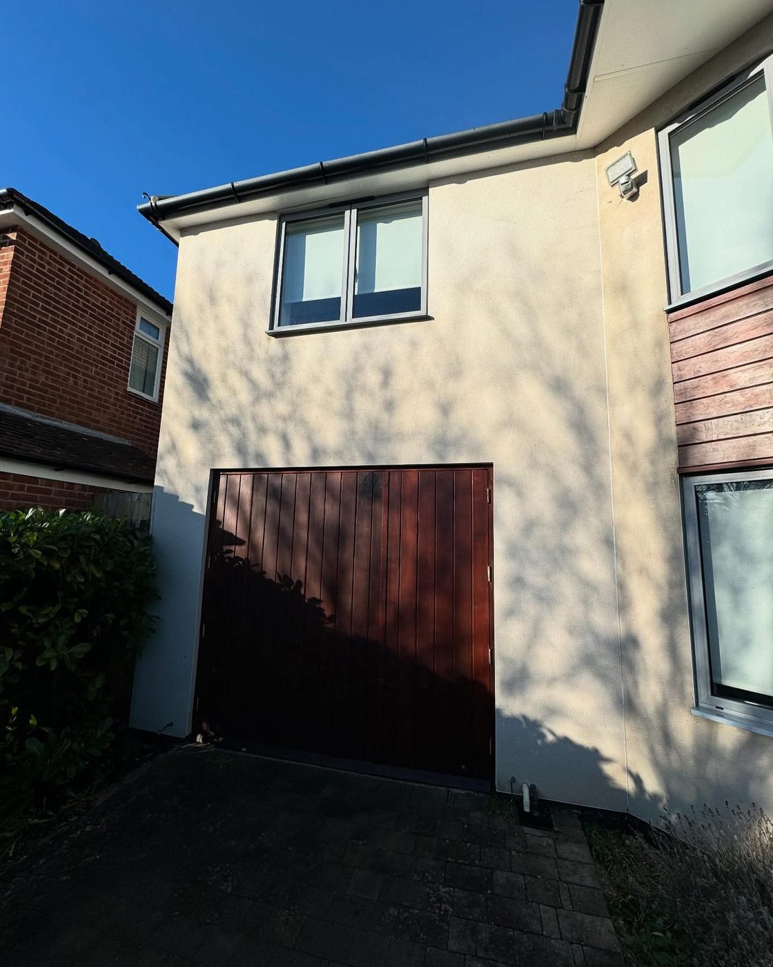 Soft-washed render brought back to colour on the front of a house