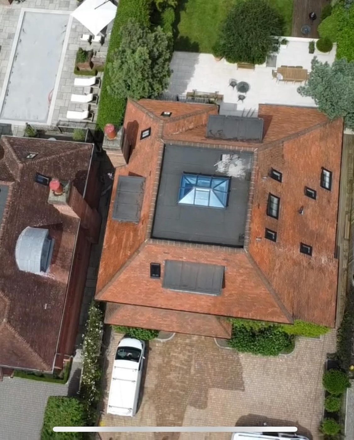 Aerial view of a glass roof lantern set into a tiled roof in West Sussex