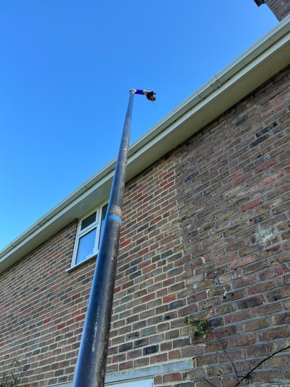 Reach-and-wash window cleaning at first-floor level in West Sussex